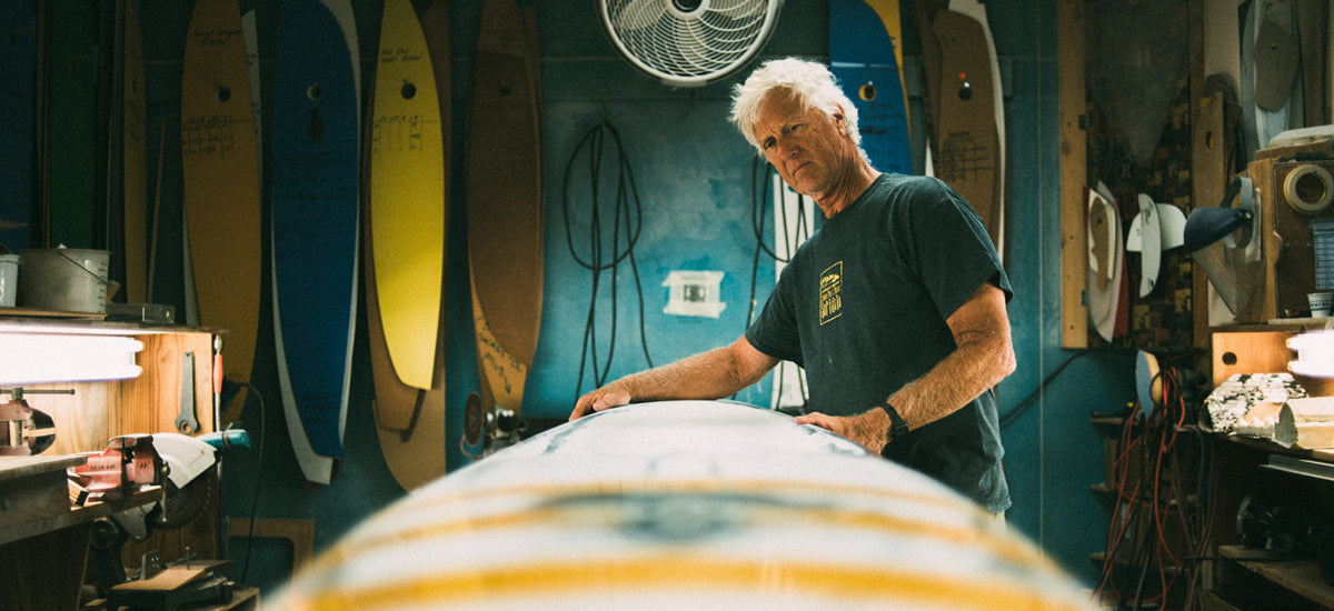 Shaper Steve Boehne holds Infinity Surfboard